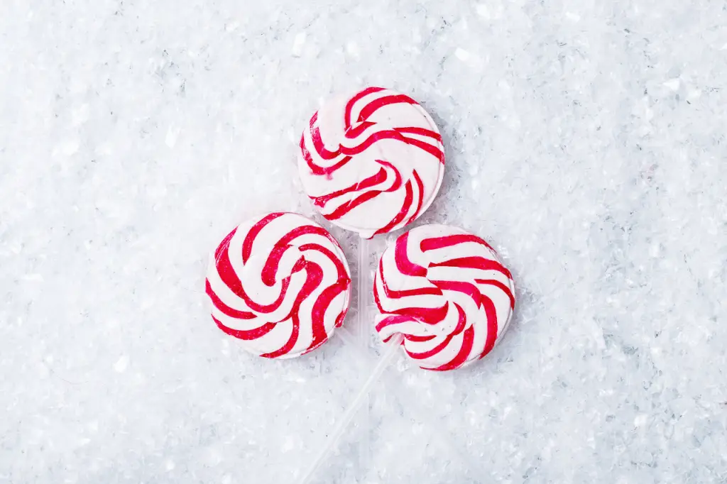 Three red spiral lollipops.